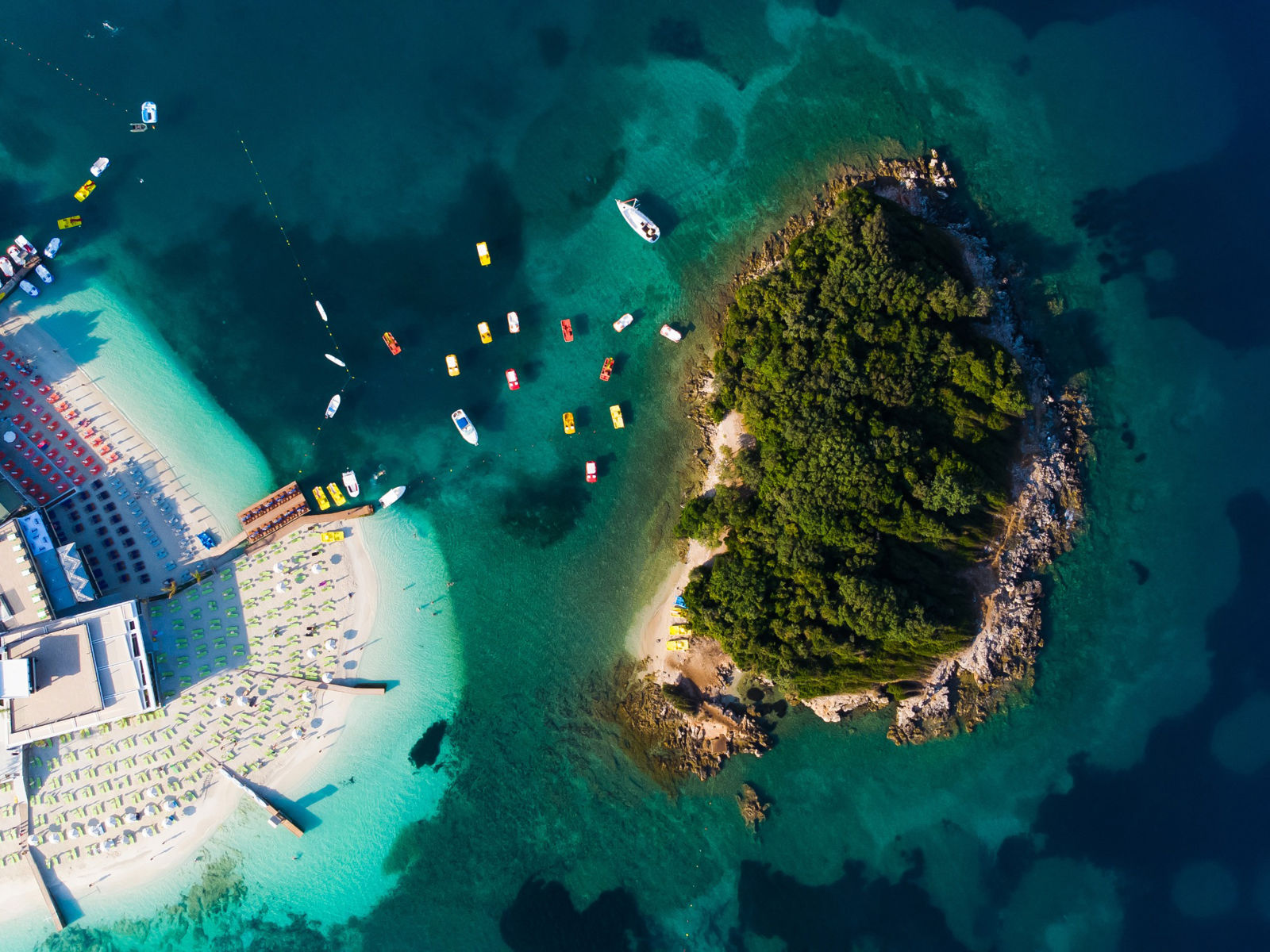 Above view of the coast and beach with blue sea