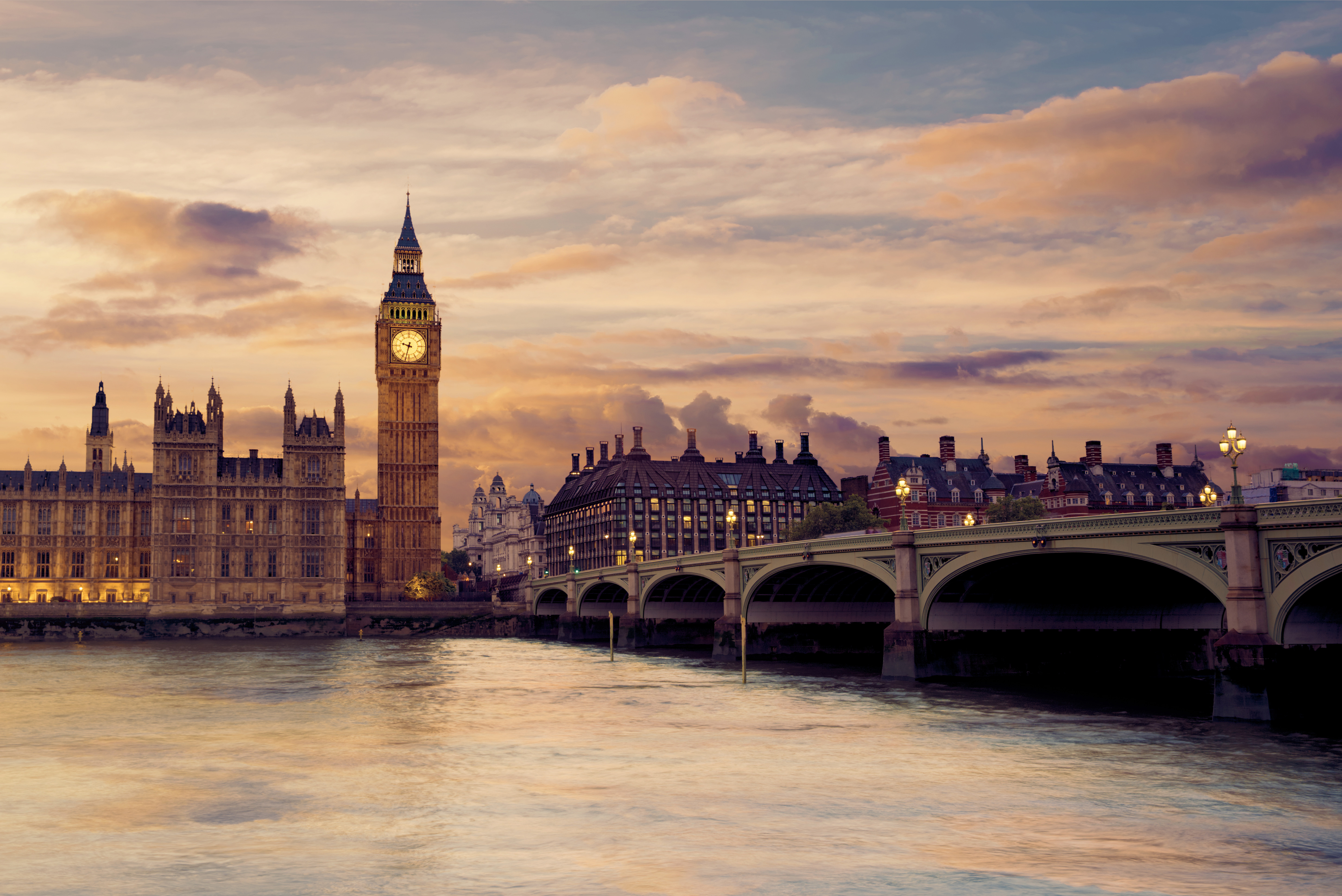 Travel to London - Big Ben and Westminster Palace at sunset with Westminster Bridge over the River Thames, London, United Kingdom.