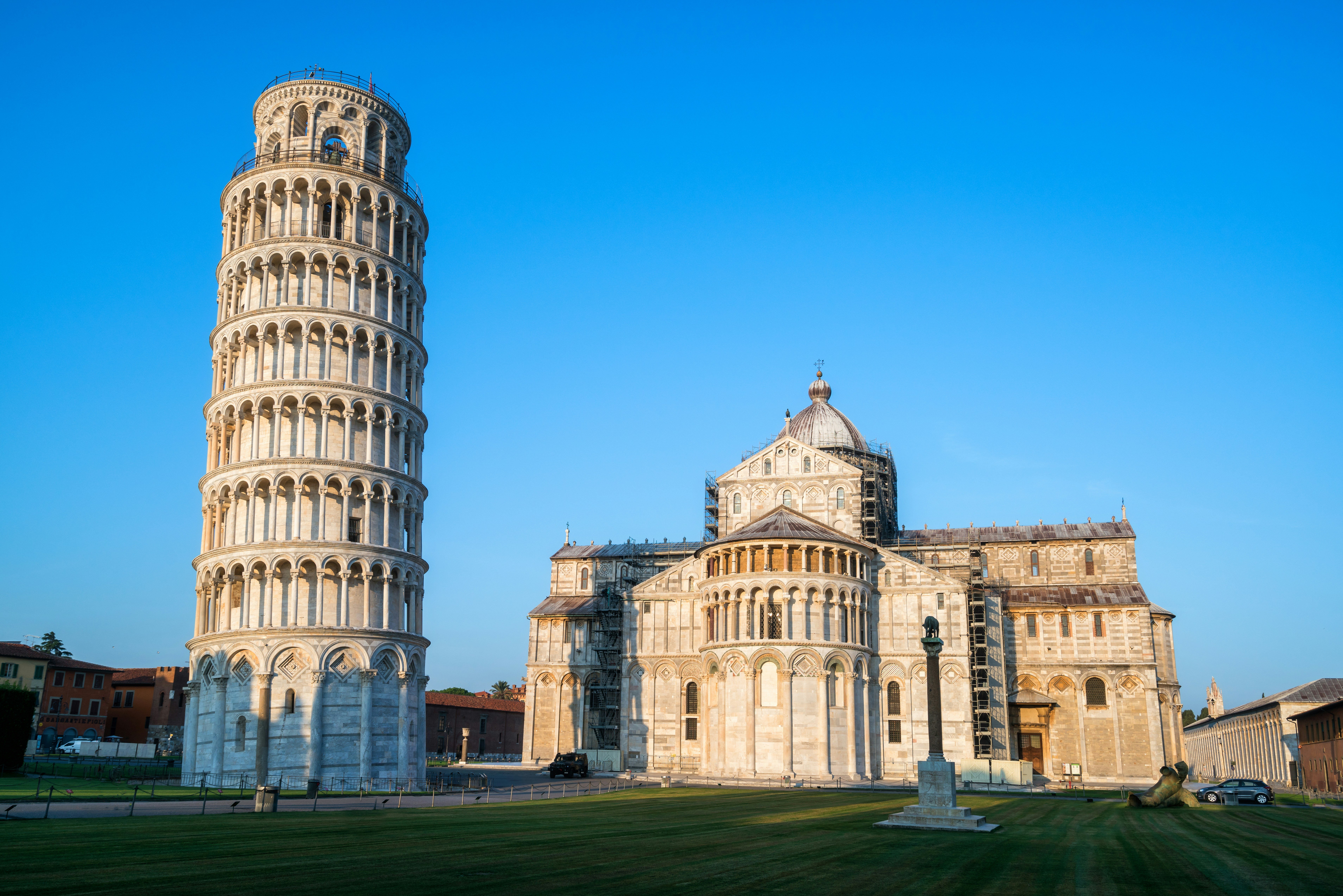 Travel to Pisa - Leaning Tower of Pisa against a blue sky in an early sunrise