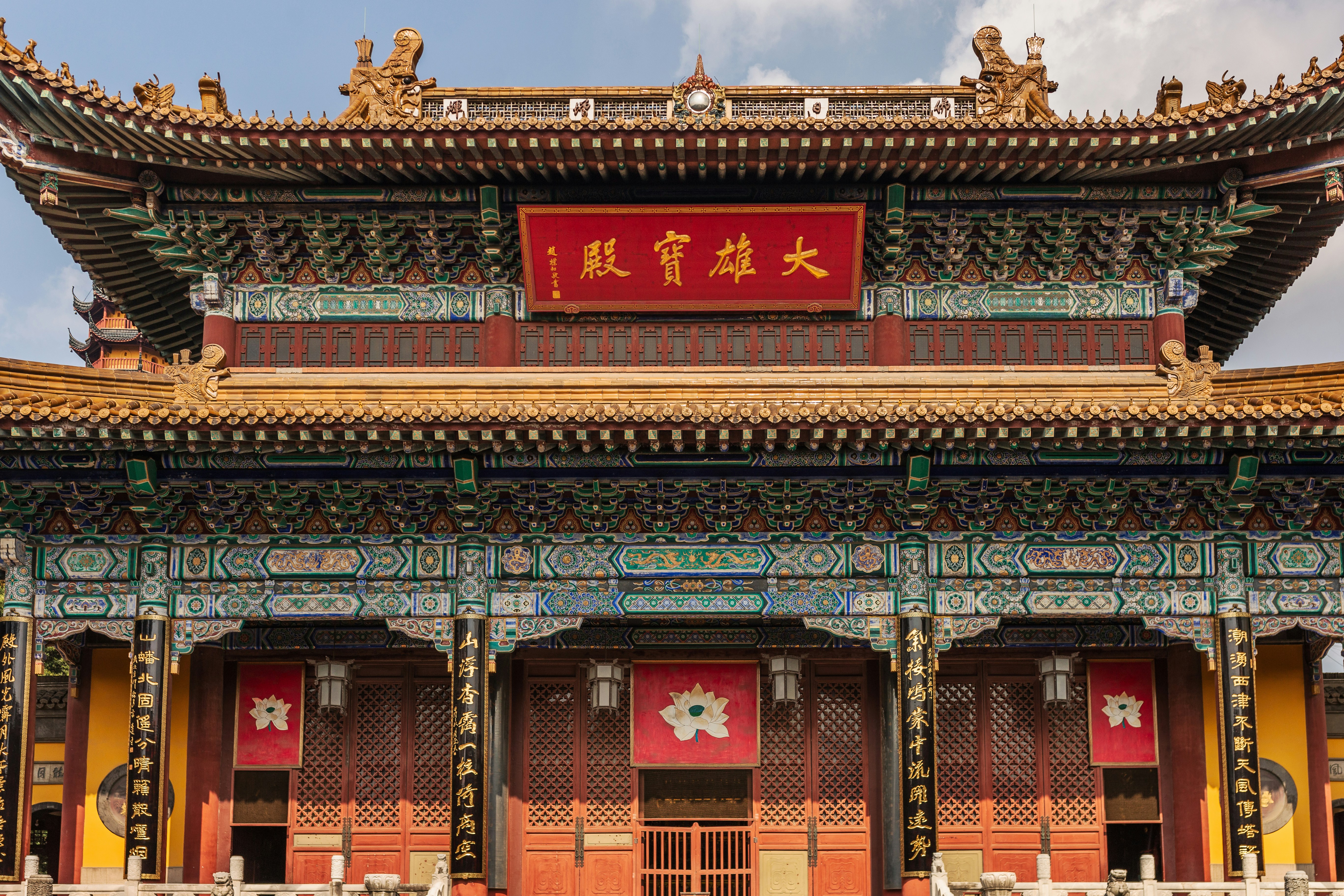 A historic temple building featuring traditional Chinese architecture with an ornate roof and colorful detailing