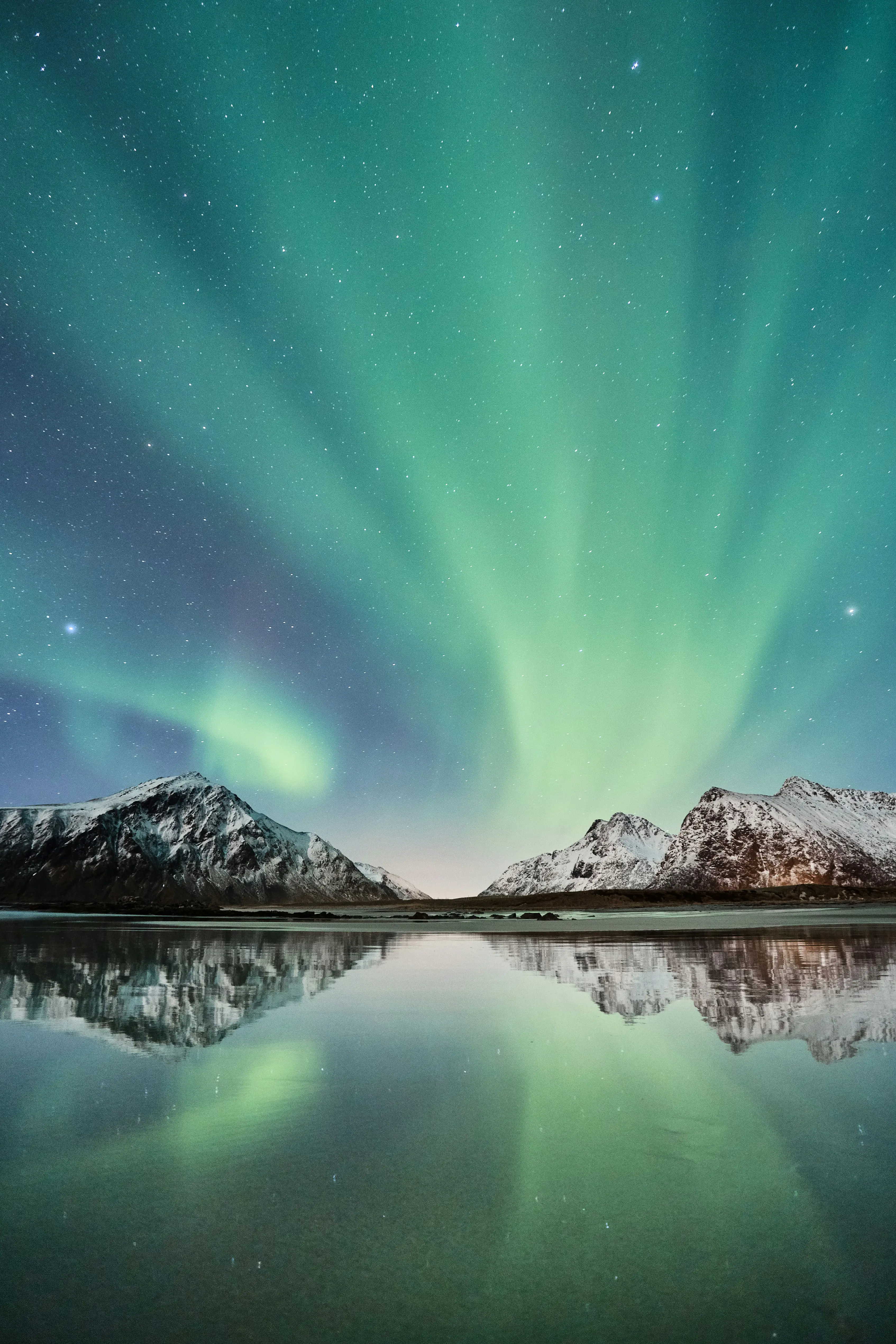 Northern Lights over the mountains in Svalbard, Norway